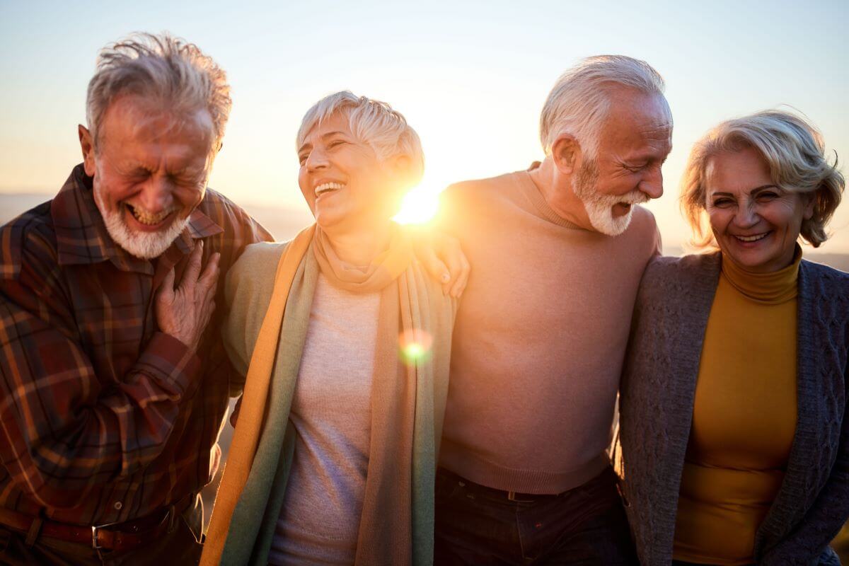 seniors laughing at Fall Harvest Celebration Hampton at Meadows Place