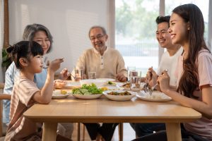 Family happily eating together