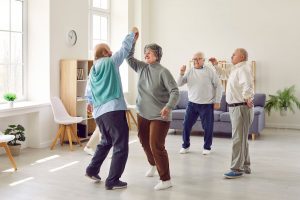 Older adults dancing together.